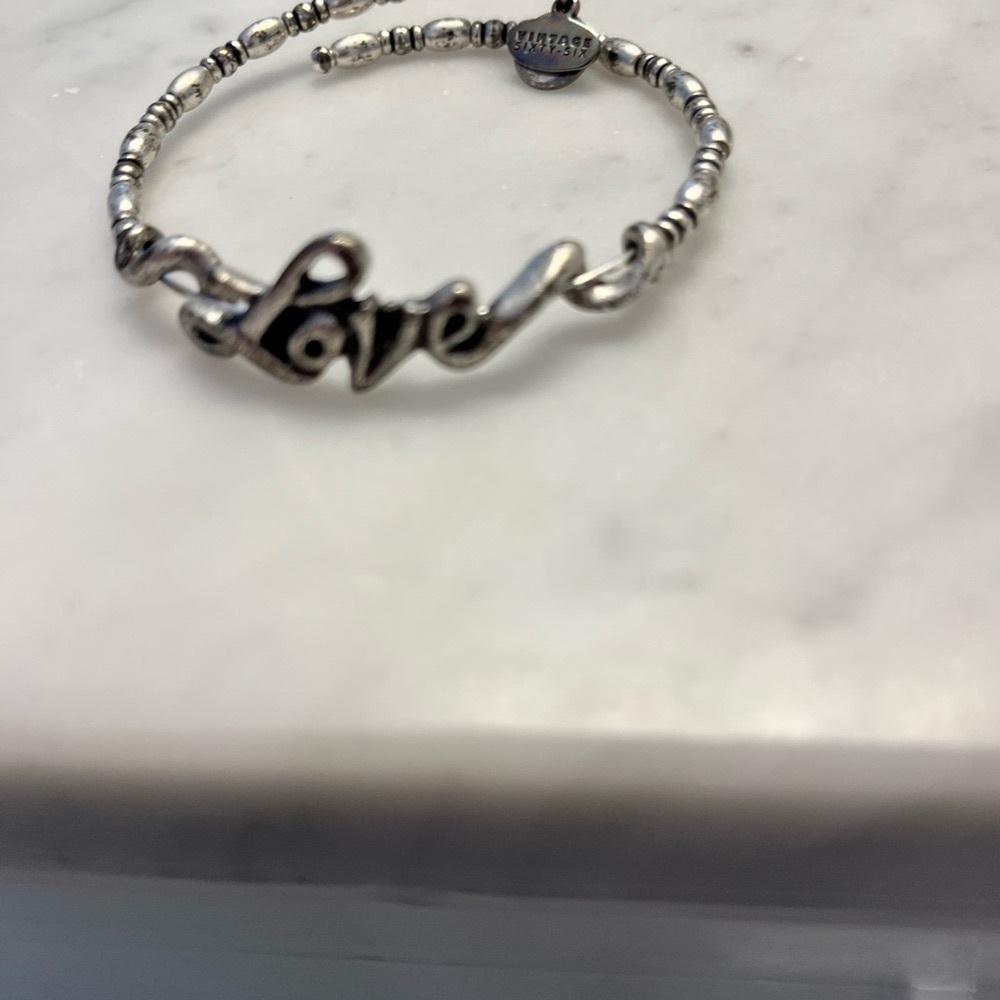 Alex and Ani Silver LOVE cursive amazing beaded detail. Beautiful bracelet.